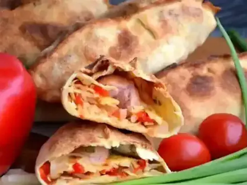 Сосиски в тісті з овочами та сиром